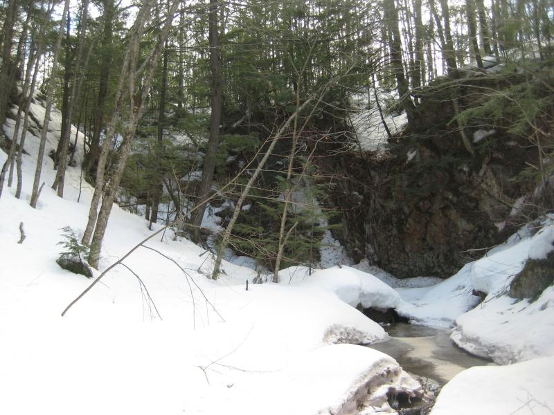 Looking up the steep rock wall